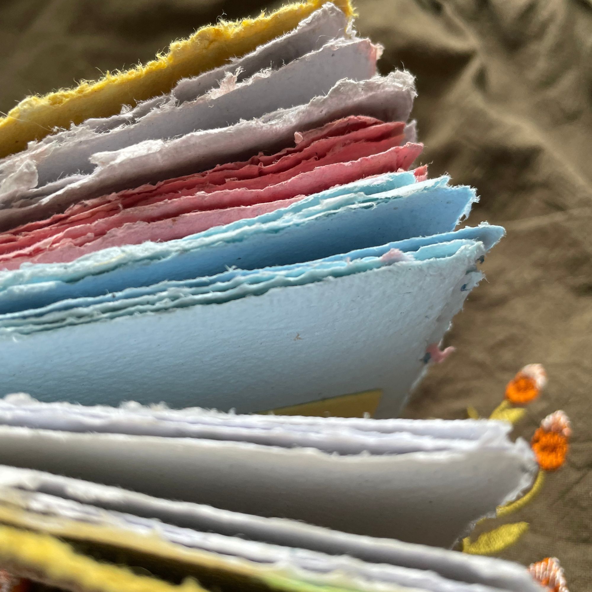Close-up of natural deckled edge on handmade paper journal