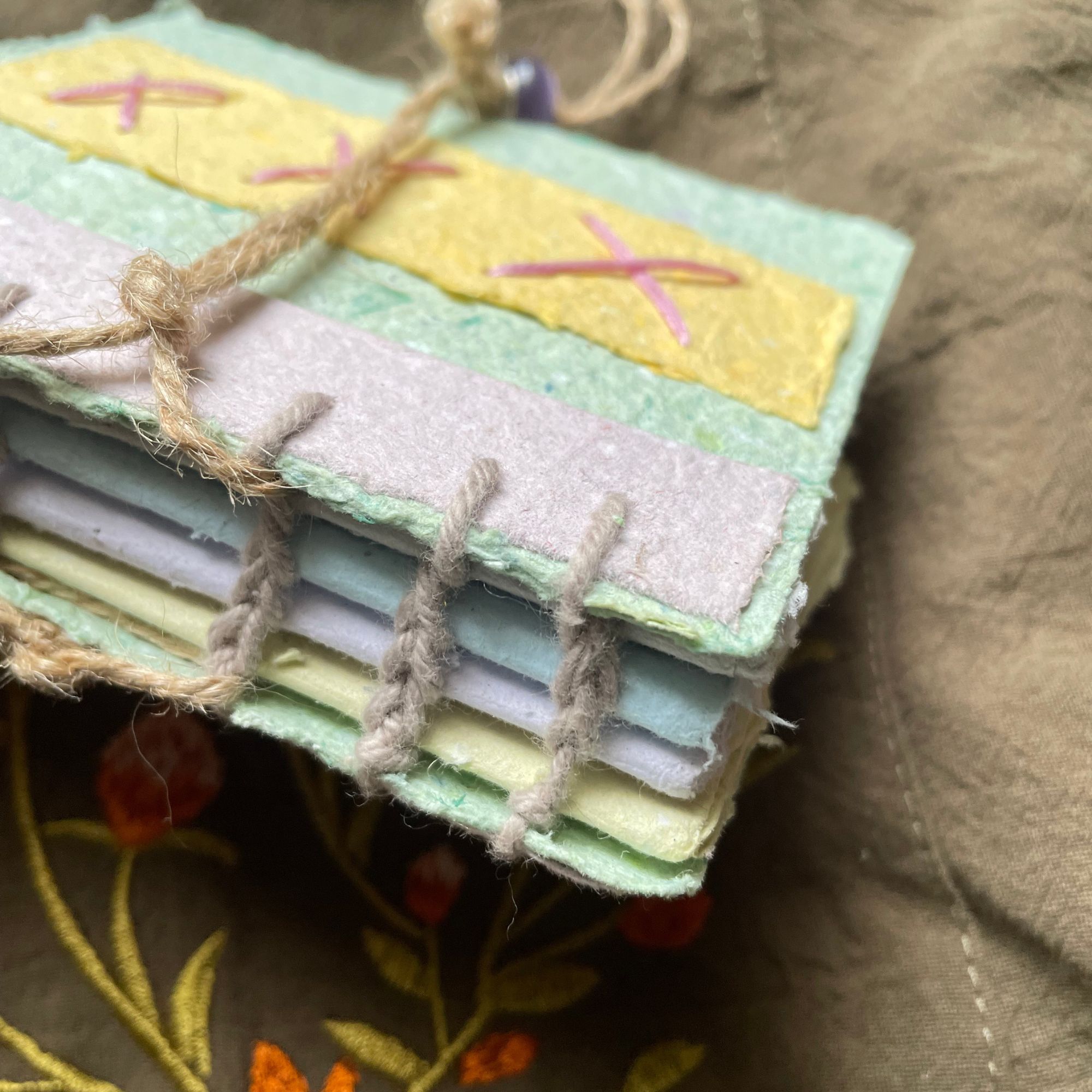 Coptic-stitched spine of the Meadow Stitch handmade paper journal