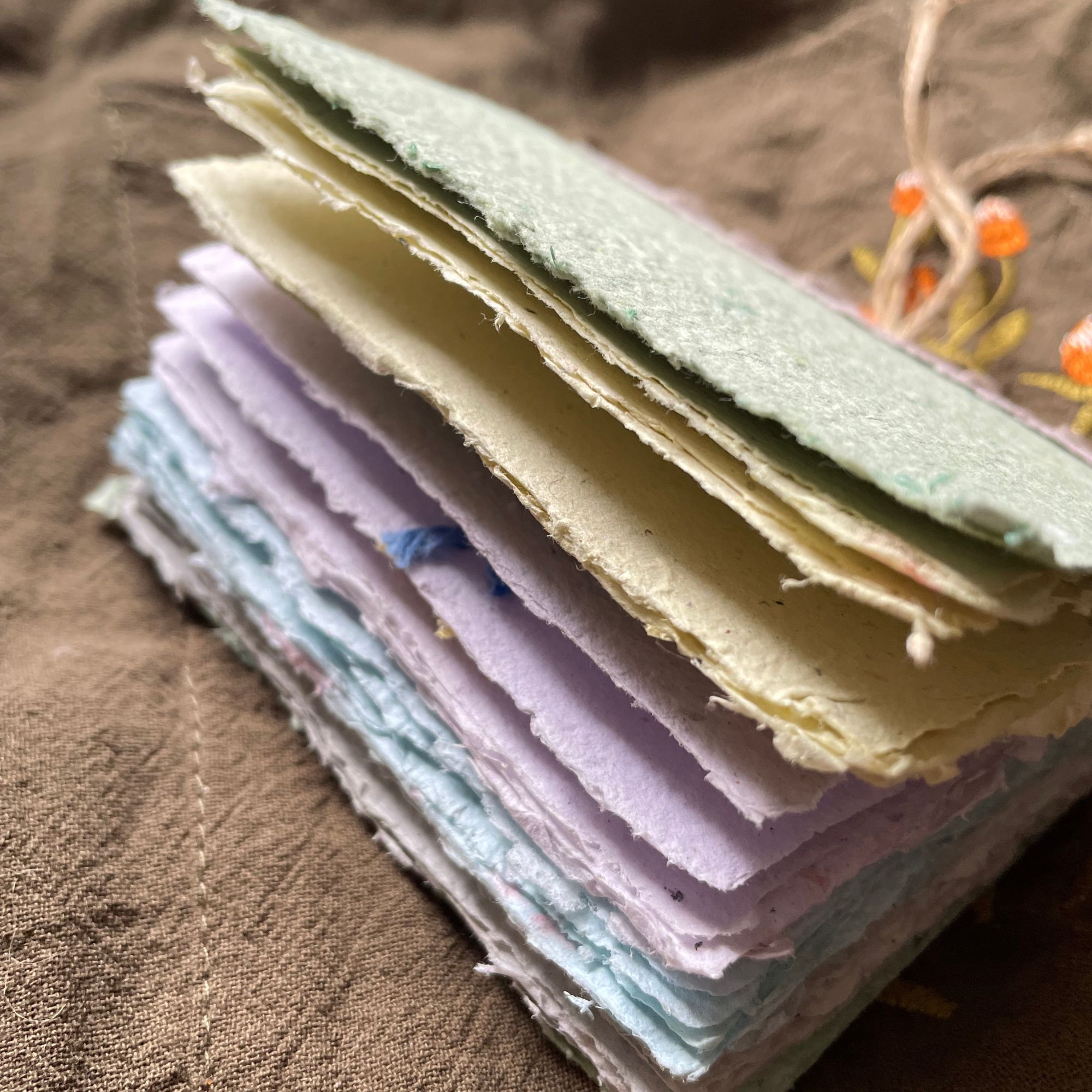 Close-up of natural deckled edge on handmade paper journal