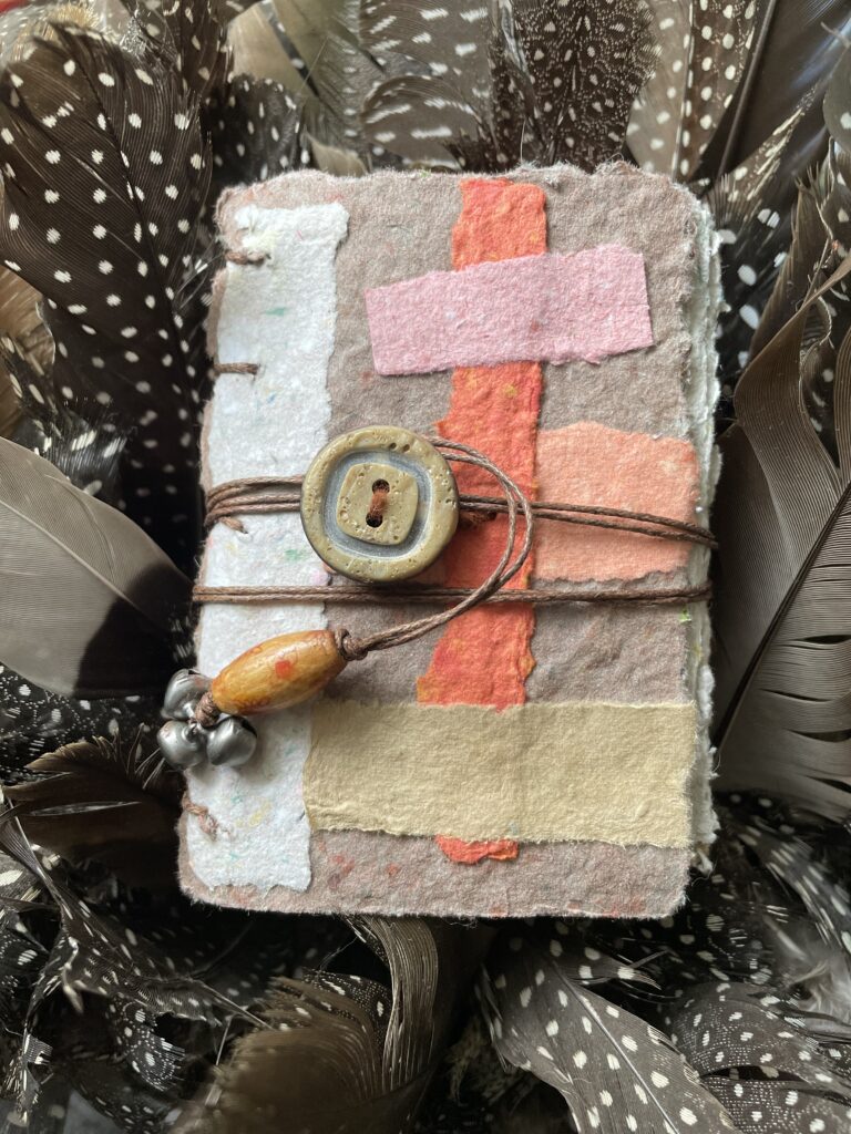 Eartha Handmade Paper Pocket Journal with closure and small bells