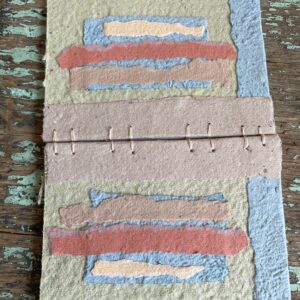 Front and back covers of Weathered handmade paper collage notebook with Coptic Stitch binding