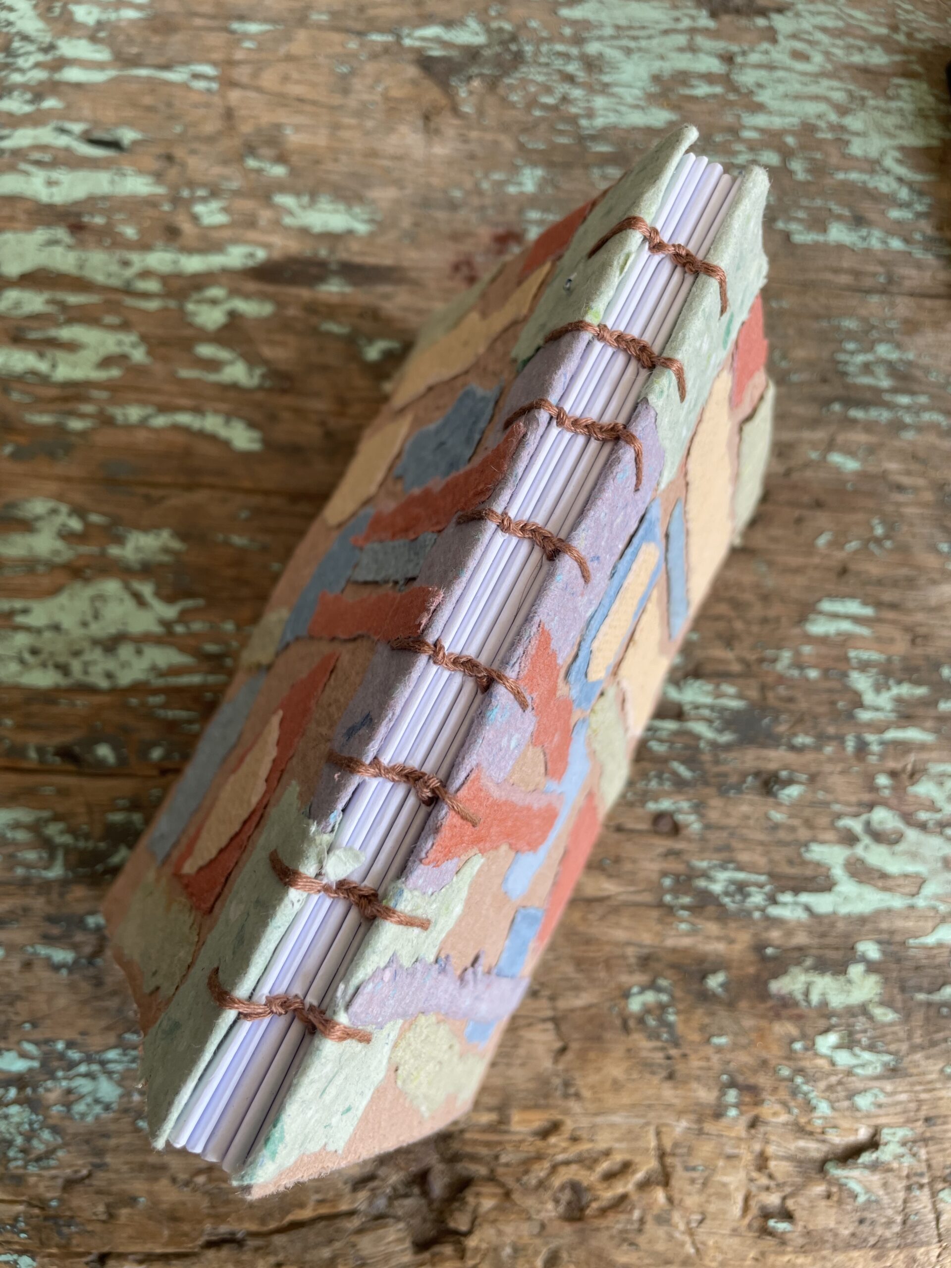 Coptic stitch binding on Sea Glass handmade paper collage notebook