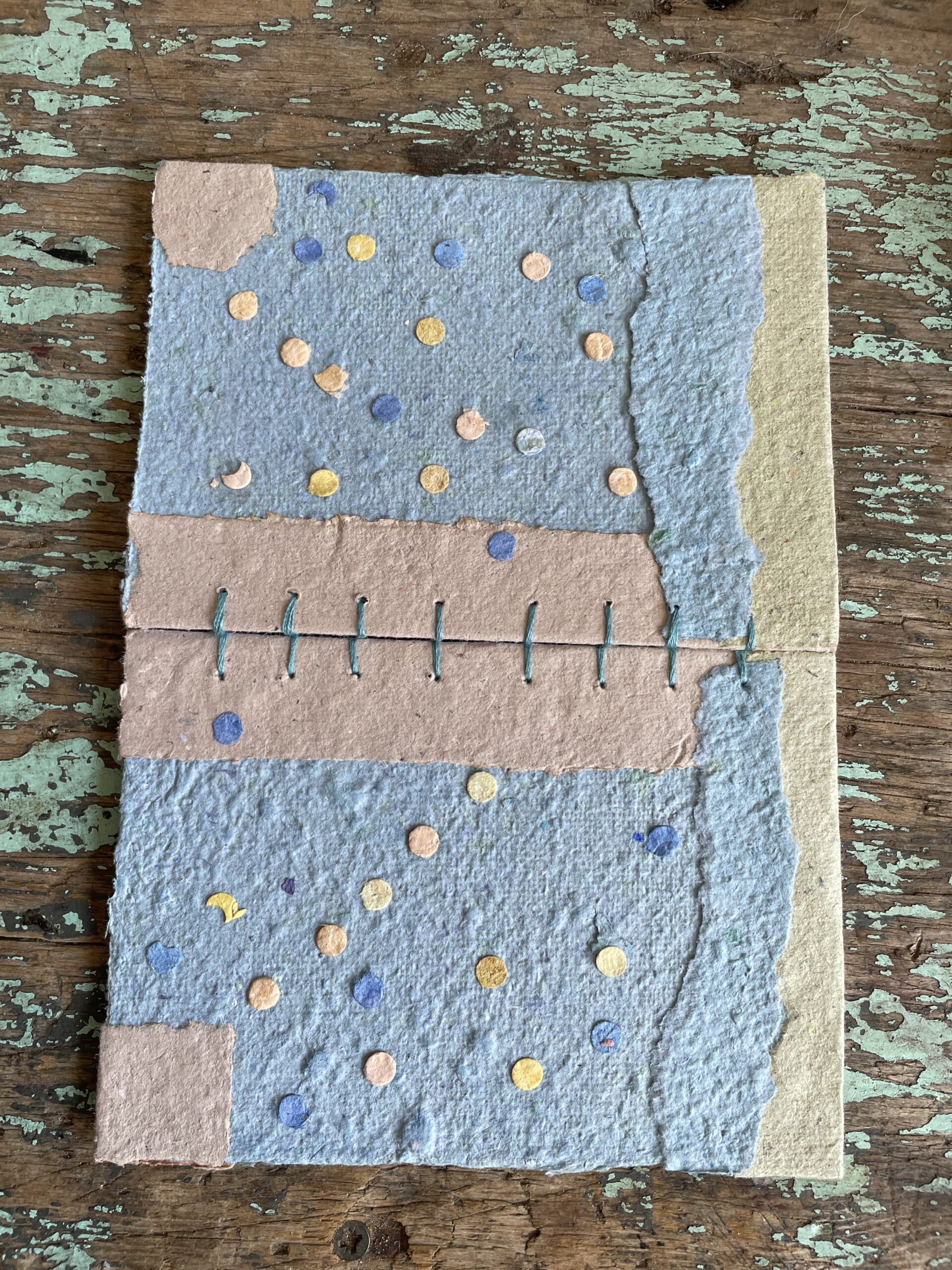 Front and back cover of Salt Air handmade paper collage notebook with Coptic Stitch binding