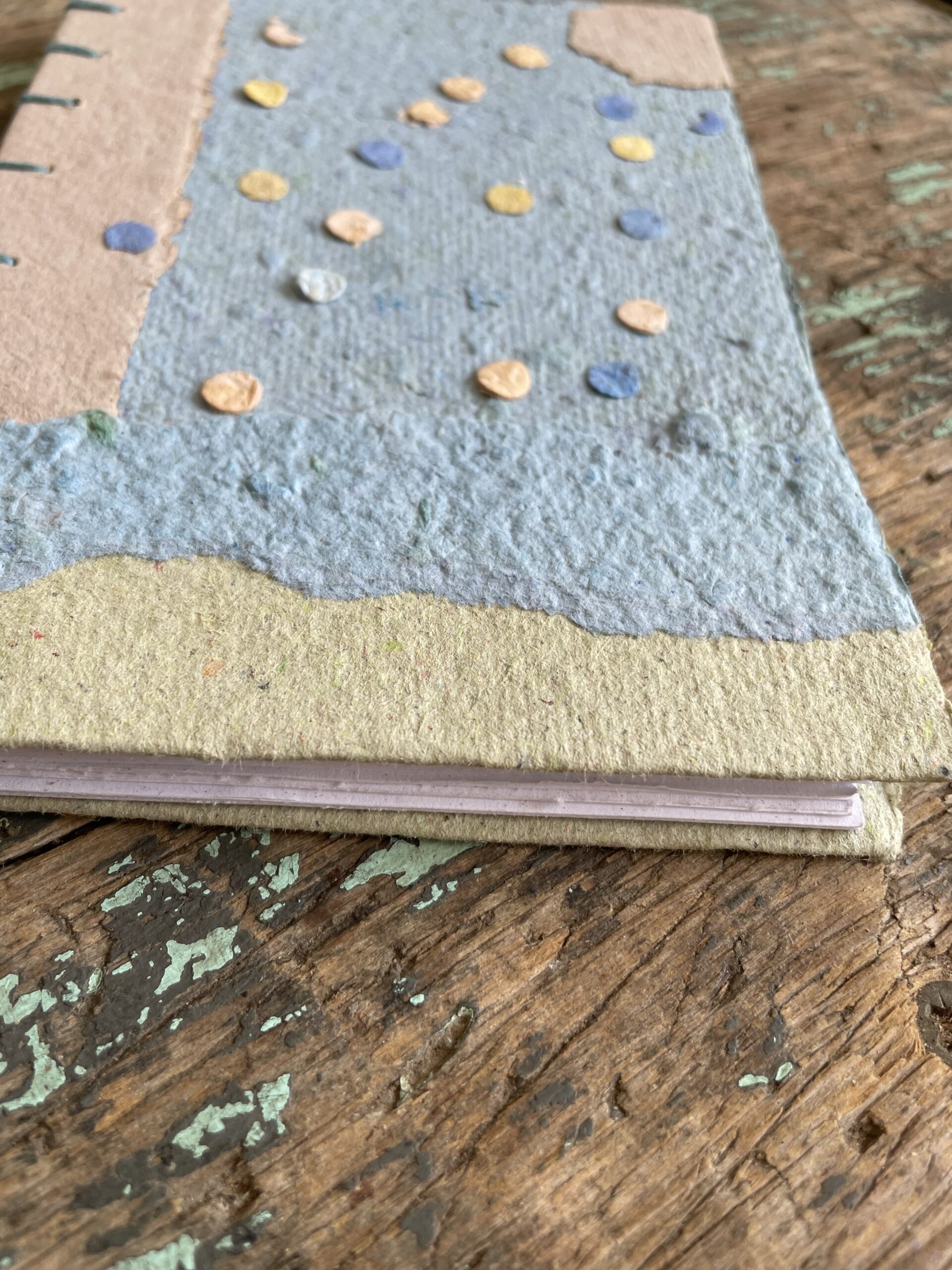Close up of textures on Salt Air handmade paper collage notebook