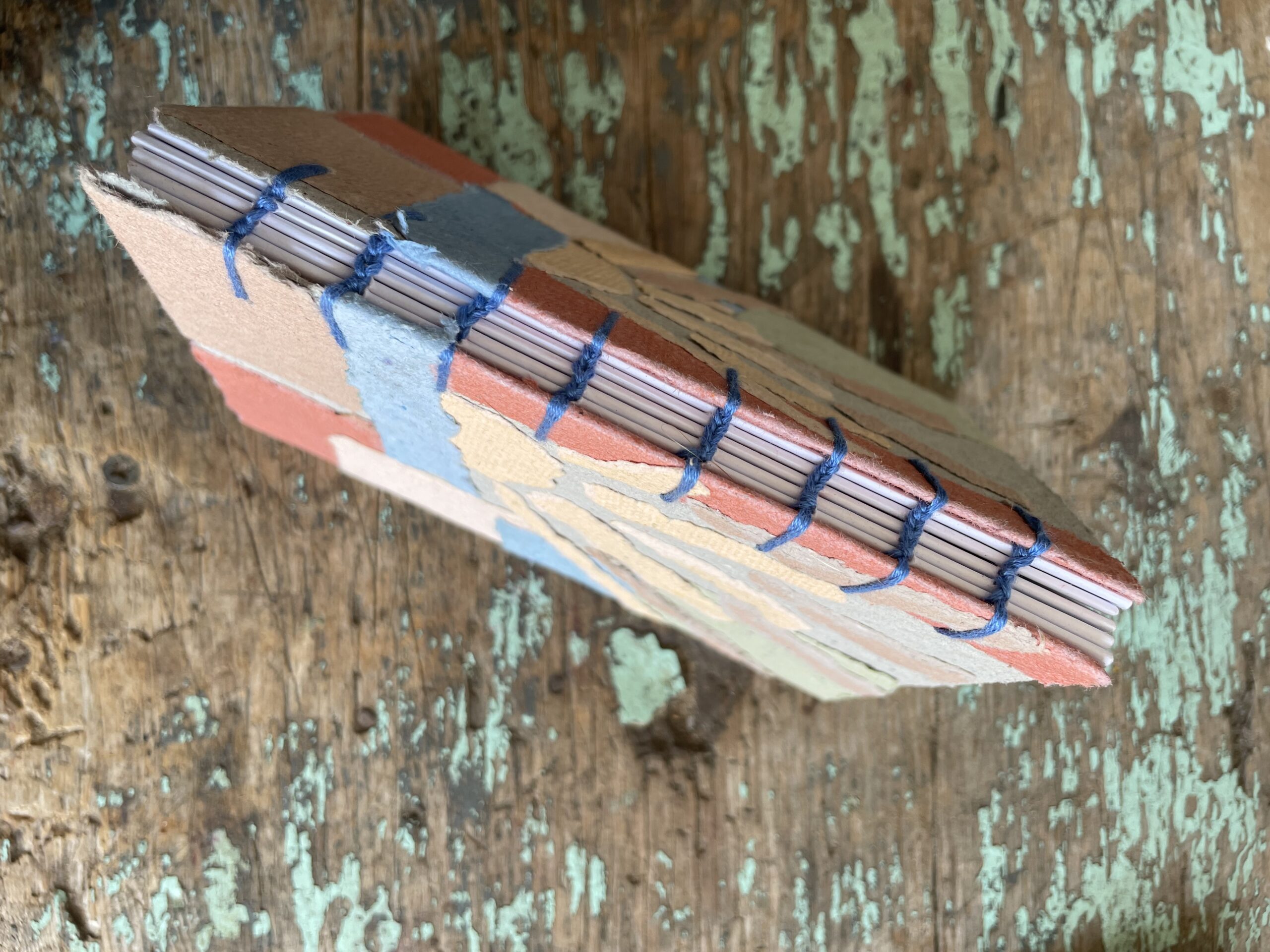 Coptic Stitch binding on Sun and Sea - handmade paper collage notebook