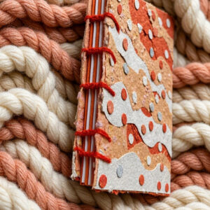 Peach Swirl Handmade Collage Notebook Coptic Stitch binding Side View